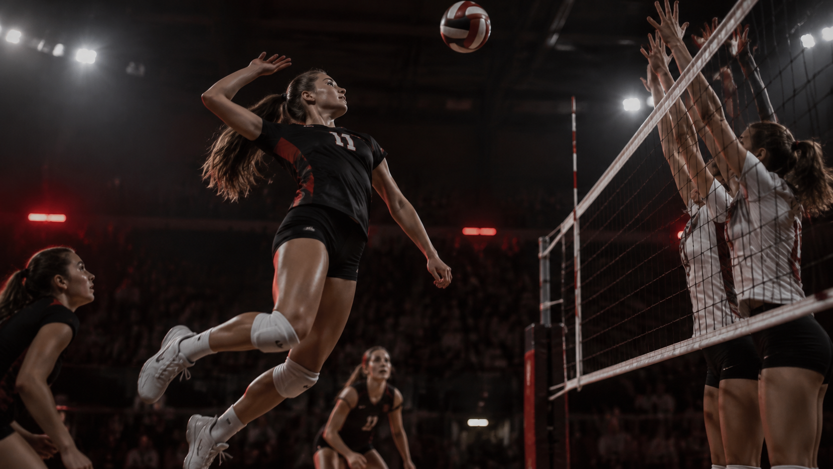 Volleyball player spiking at the net in a school gym